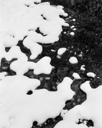 Snow melting into Middle Pond, Burnham Beeches January 2013